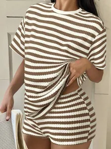 Detail of women's brown and white striped t-shirt and shorts set with waffle texture