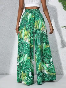 Detail view of tropical leaf print wide-leg pants with comfortable elastic waist