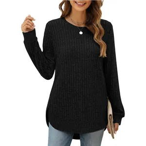 Women's black ribbed knit long sleeve top with curved high-low hem, loose fit style.