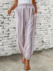 Pantalones bohemios con estampado étnico, cintura elástica alta y bolsillos laterales