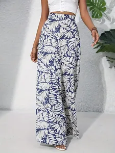 Detailed view of high-waisted leaf print wide-leg pants for a stylish breezy summer look