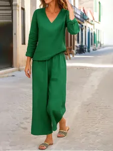 Elegante set casual verde da donna con top a maniche lunghe scollo a V e pantaloni larghi