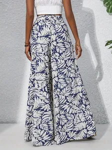 Stylish back view of womens high waisted tropical leaf print summer wide leg trousers