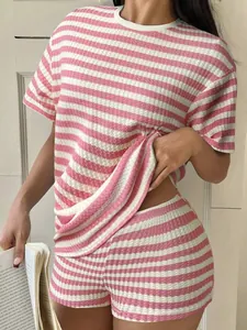 Detail showing the pink and white striped waffle knit fabric on a casual women's loungewear set