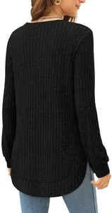 Back view showing the curved hem of this black ribbed long-sleeve knit top for women