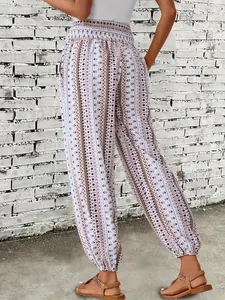 Detail view of Bohemian ethnic print harem pants with smocked waist and cuffed ankles