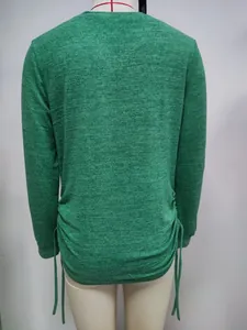 Back view of a green heathered long-sleeve T-shirt with ruched drawstring detail sides.