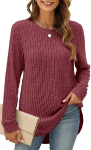 Detailed view of the maroon ribbed texture and high-low curved hem on this loose women top.