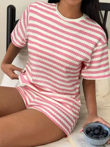 Detailed macro view of pink striped short sleeve T-shirt set with textured fabric feel