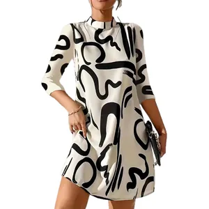 Elegant white A-line dress featuring black abstract graphic print and stylish 3/4 sleeves.