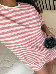Close-up detail of a women's pink and white striped waffle knit casual lounge set