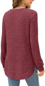 Back view of wine red loose long sleeve top with high-low curved hem and ribbed texture