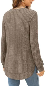 Back view detail of a brown ribbed long-sleeved top featuring a high-low curved hemline.