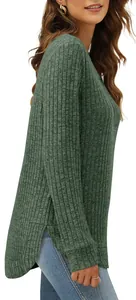 Side detail showing the high-low curved hem of a dark green ribbed knit long sleeve top