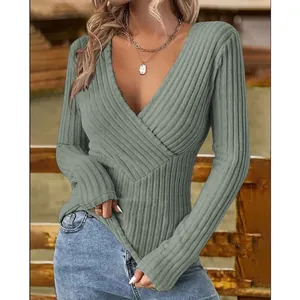 Detail shot showing the deep V-neckline and elegant ribbed texture of this slim-fit green top.