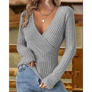 Close-up of elegant grey ribbed V-neck slim fit long sleeve shirt for women