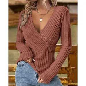 Detail view of women's ribbed knit V-neck slim fit long sleeve top in terracotta