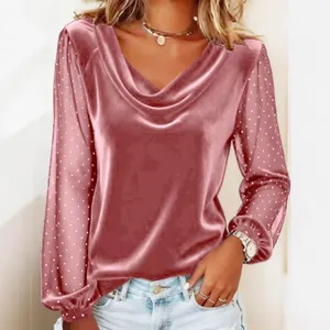 Elegant pink V-neck velvet top with rhinestone mesh sleeves for a chic fashion look.