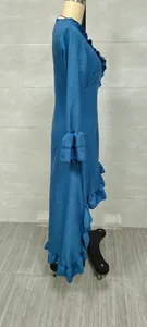 Side detail view of a bohemian blue maxi dress featuring a ruffled hem and long sleeves