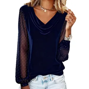 Elegant navy blue V-neck velvet top featuring sheer mesh long sleeves with rhinestones.