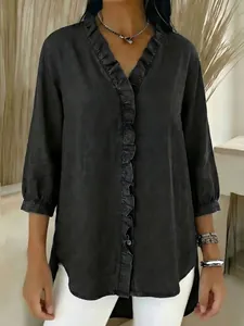 Close-up detail of a women's black ruffle V-neck faux denim shirt with button front.