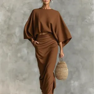 Elegant brown two-piece clothing set featuring a loose top and high-waist maxi skirt