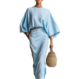 Elegant light blue two-piece set with loose long sleeve top and high waist maxi skirt