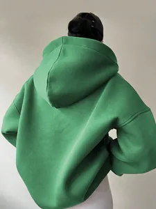 Rear view of an oversized green hoodie for women featuring a comfortable loose fit style.