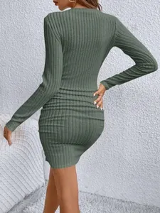 Back view of a chic olive green ribbed bodycon mini dress with long sleeves and slim fit
