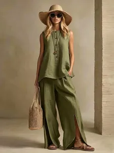 Detail shot of green cotton linen two-piece set featuring sleeveless top and slit pants