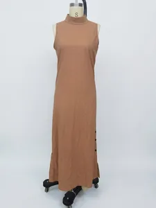 Full-length view of a sleeveless cotton linen dress with side button slit detail.