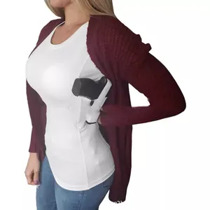 Detailed view of white tactical T-shirt featuring integrated concealed handgun holster design
