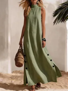 Detail view of a green sleeveless cotton linen maxi dress with side buttons and slit