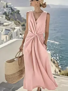 Elegant pink linen V-neck sleeveless maxi dress with twist waist and pockets.