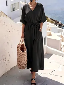 Loose casual short-sleeved maxi dress with waist tie shown in a Mediterranean vacation setting