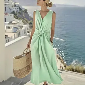 Elegant mint green V-neck sleeveless linen maxi dress with twist waist detail and pockets