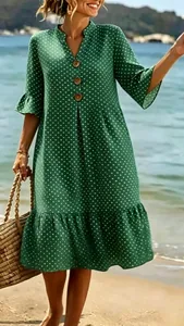 Stylish green V-neck bohemian dress with white polka dots and delicate ruffle hem details