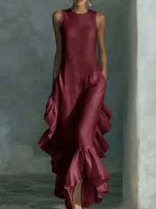 Detail showing ruffled hem and textured fabric of sleeveless burgundy maxi dress