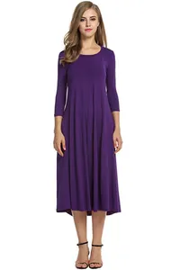 Élégante robe midi violette à manches longues avec plissé et ourlet évasé fluide.