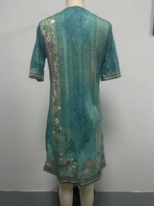 Back detail of ethnic style floral print teal casual dress shown on a mannequin