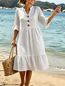 Elegant white V-neck polka dot holiday dress with ruffle sleeves and tiered hem
