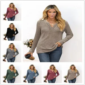 Display showing various color options and fit of the women's ribbed knit V-neck top