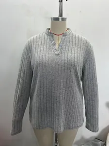 Close-up detail of a grey ribbed V-neck long-sleeve loose casual shirt for women
