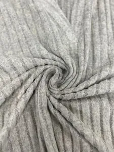 Close-up view of grey ribbed knit fabric showing soft fleecy texture and vertical patterns.