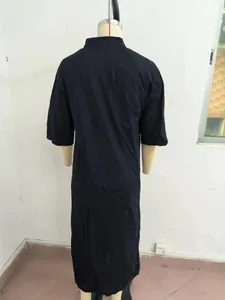 Back view of a minimalist black loose-fit cotton linen maxi shirt dress on a mannequin