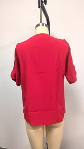 Detailed back view of a solid red V-neck cold shoulder short sleeve top for women