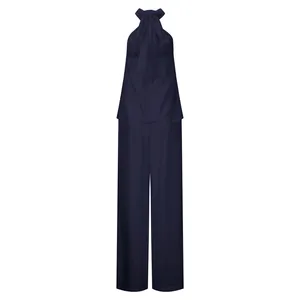 Elegante set due pezzi blu scuro con top senza maniche allacciato al collo e pantaloni larghi