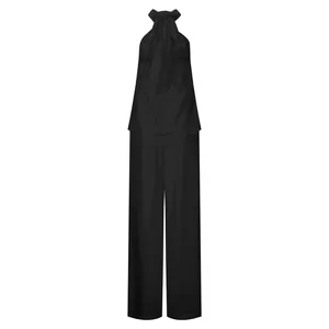 Elegante completo due pezzi con top all'americana nero e pantaloni a gamba larga