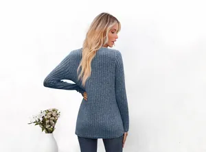 Detailed back view of a women's blue ribbed long-sleeve top showing slim fit and fabric texture.
