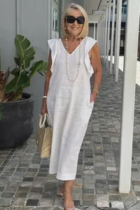Elegant white cotton linen maxi dress featuring ruffle sleeves and a flattering V-neckline
